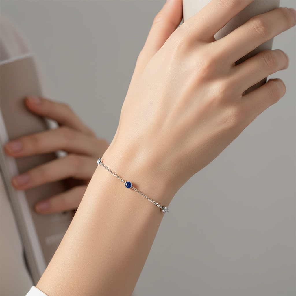 Model wearing diamond sapphire station bracelet