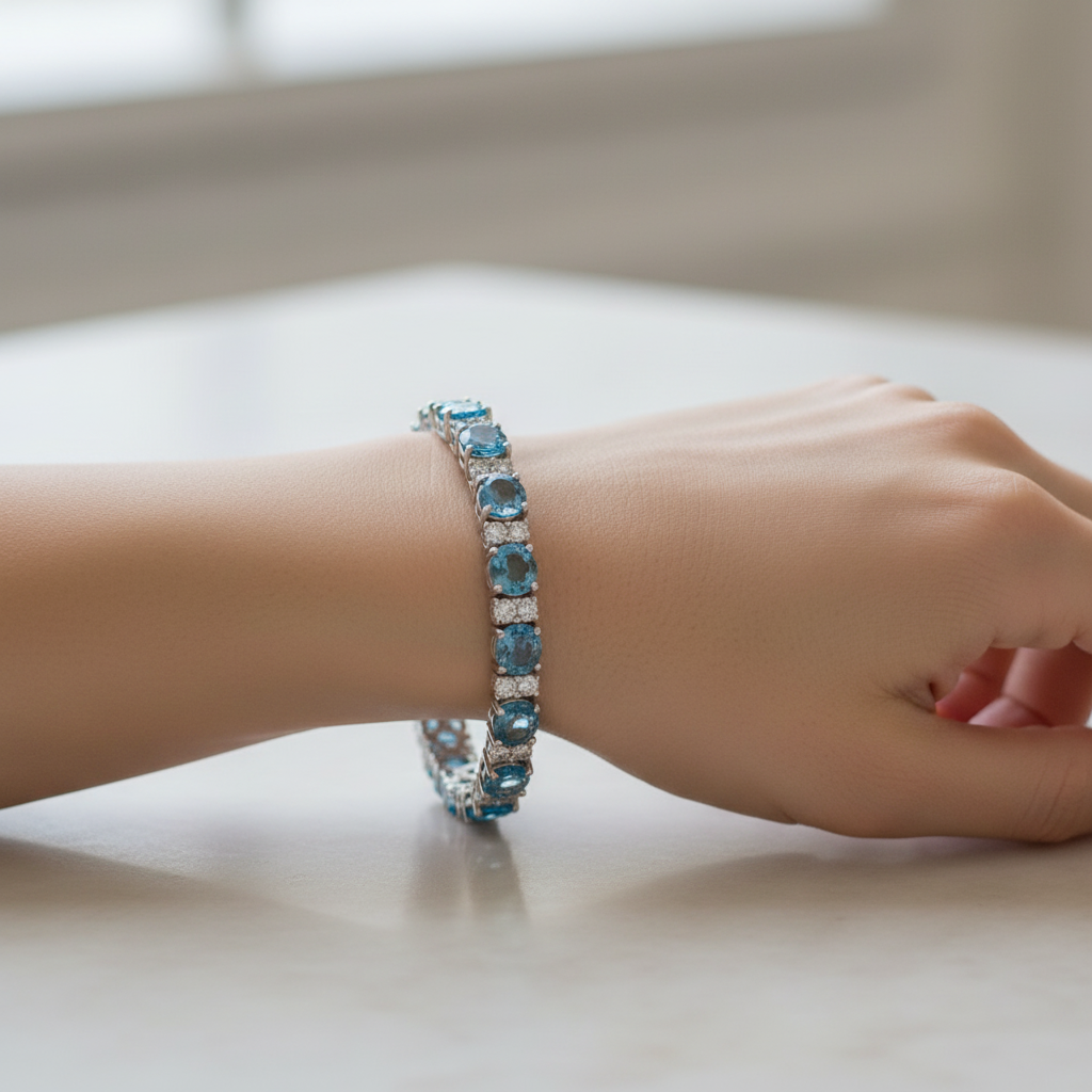 Model wearing Swiss blue topaz diamond tennis bracelet