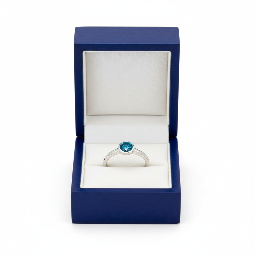 14k white gold ocean blue solitaire diamond ring with 0.50 ct tw, placed in a royal blue wooden box.