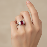14k gold fashion ring with an octagon-shaped ruby and diamond accents, displayed on a hand.