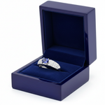 14k gold oval tanzanite and diamond fashion ring with 1.75 cts tw, displayed in a royal blue gift box.
