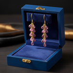 14k gold teardrop pink tourmaline earrings with 13 carats total weight in a gift box, showcasing elegant jewelry design.