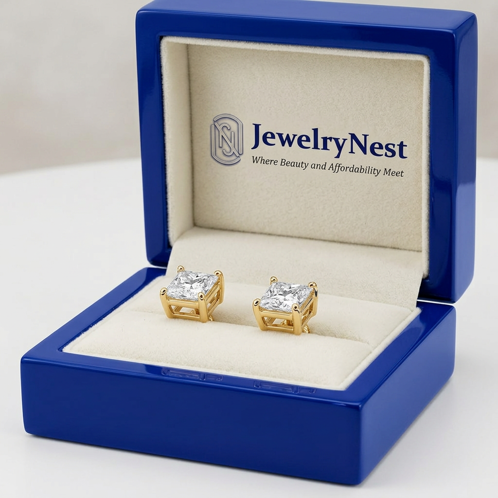 Princess-cut diamond studs in a royal-blue wooden box with the JewelryNest logo