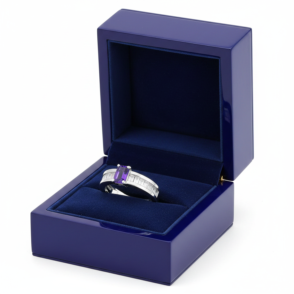 14k gold fashion ring featuring a rectangular Tanzanite and diamond accents in a royal blue gift box.