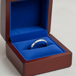 14k white gold knife edge wedding band, 3mm plain design, shown in a royal blue jewelry box.