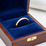 14k gold yellow knife edge wedding band, 5mm wide, handcrafted jewelry in royal blue box with smooth, polished finish.
