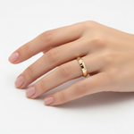 14k yellow gold wedding band with a knife edge design, 5mm width, handcrafted by JewelryNest, shown on a model.